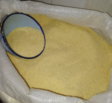 Golden yellow garri in an export sack